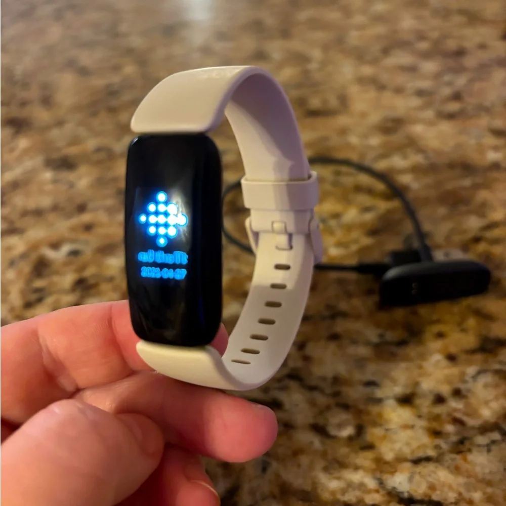 Excellent used condition. Includes charger and extra strap.